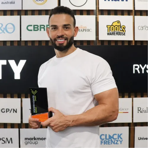 OMG co-founder Andrew Raso holding APAC Search Awards 2025 trophy for best use of AI in PPC