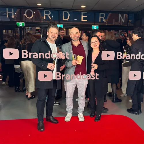Three members of the Online Marketing Gurus programmatic team at the YouTube Brandcast event at the Hordern Pavilion, holding drinks on the red carpet.