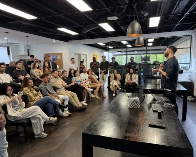 OMG team gathered in the office for an all-hands town hall meeting