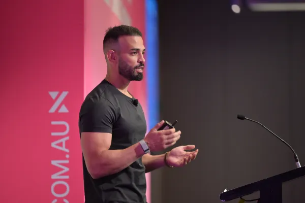 Andrew Raso speaking on stage at the Marketing Leader Summit