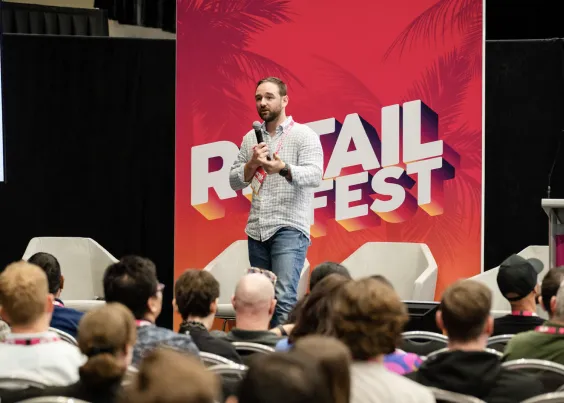 Matt from OMG presenting a keynote to attendees at Retail Fest