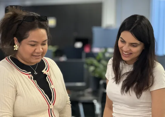 Two OMG team members reviewing ongoing growth loop performance together