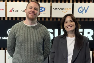 OMG paid social specialists in front of a wall of client brand logos including Carnival, CatholicCare and QV