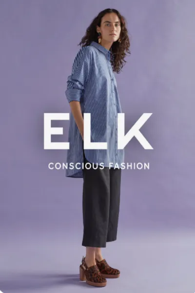 ELK Conscious Fashion social ad featuring a model in a striped shirt and dark trousers against a lavender backdrop
