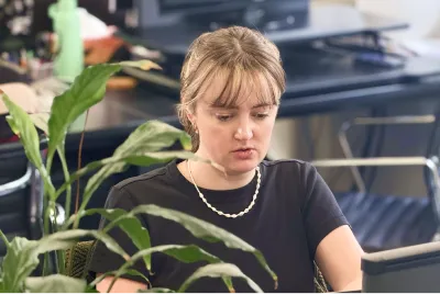 OMG SEO link building specialist working at her desk in the Sydney office