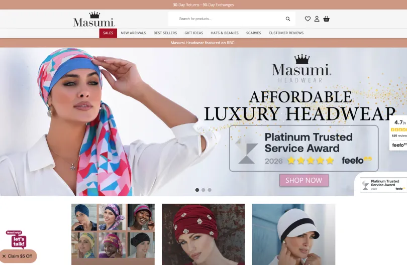 Masumi Headwear homepage showing the Affordable Luxury Headwear banner, Feefo Platinum Trusted Service Award and product categories for hats, beanies and scarves
