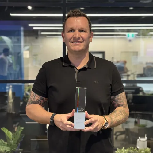 Ryan Alborough, General Manager US, holding an OMG agency award