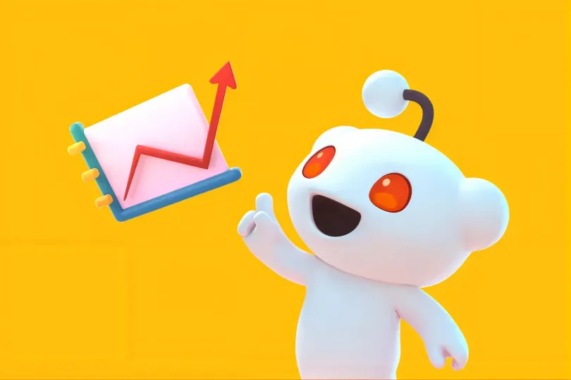 3D Reddit mascot pointing at a rising line chart